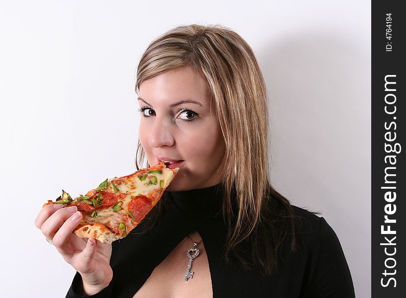 girl eating pizza slice