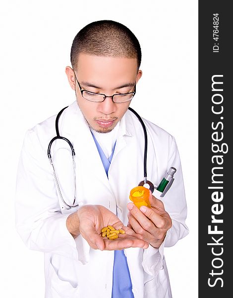Male nurse counting pills to give to patient.
