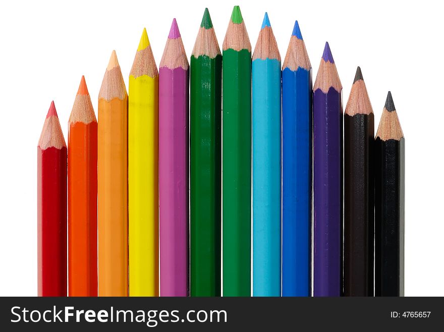 Colored pencils isolated on white arranged in a curve