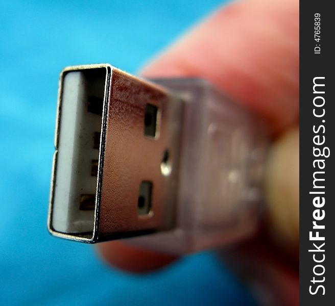 Macro shot of a USB plug being held