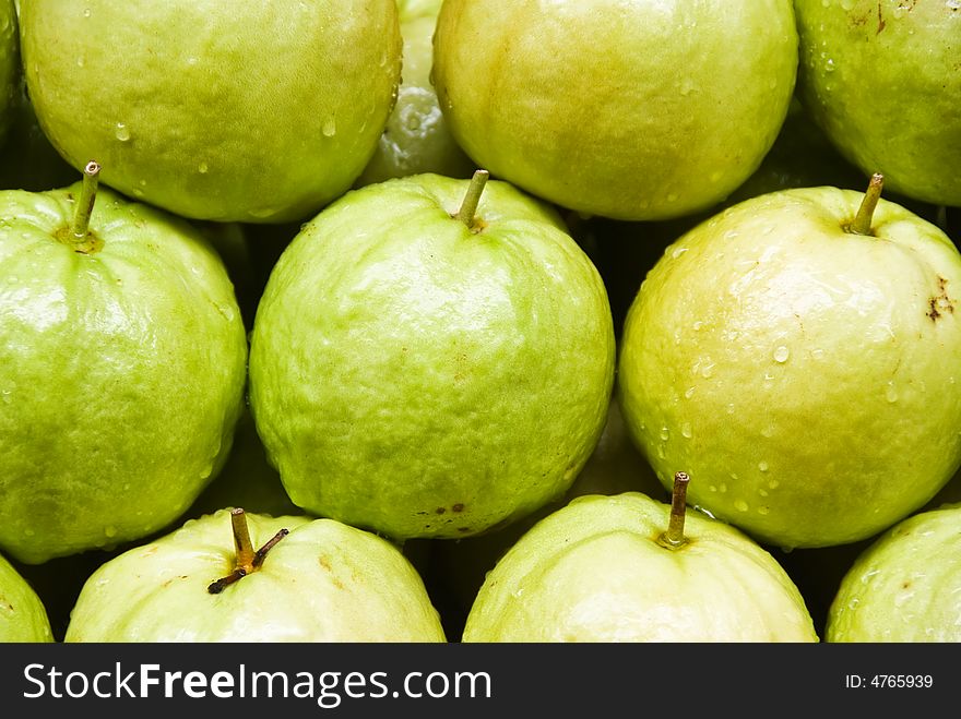 A row of guava fruit for sale