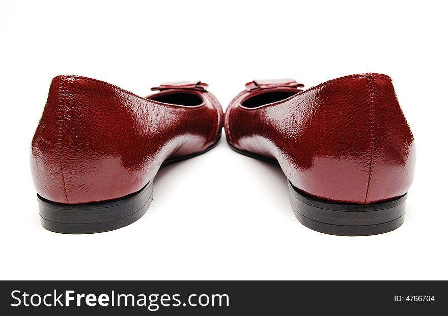 Red womanish shoes on a white background