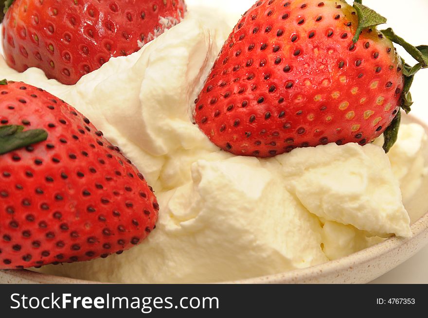 Strawberry with the cream, isolated on a white background