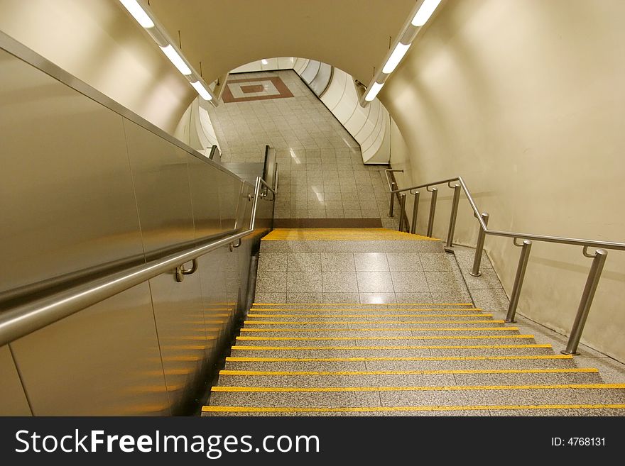 The staircase leading to the platform of a subway station. The staircase leading to the platform of a subway station