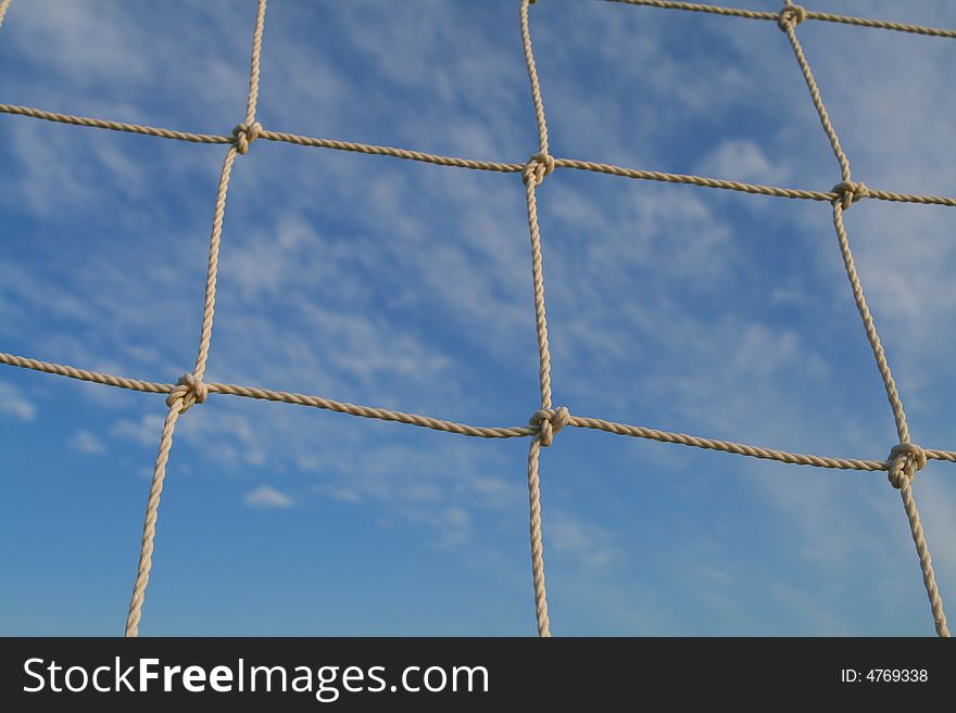 Soccer net with a blue sky background