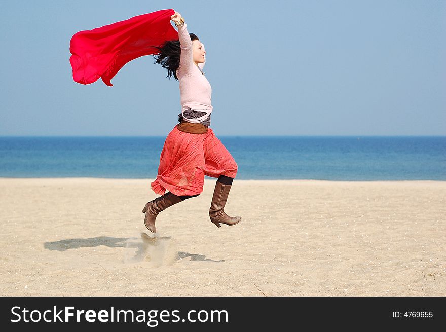 Freedom attractive brunette woman on the sunny beach. Freedom attractive brunette woman on the sunny beach