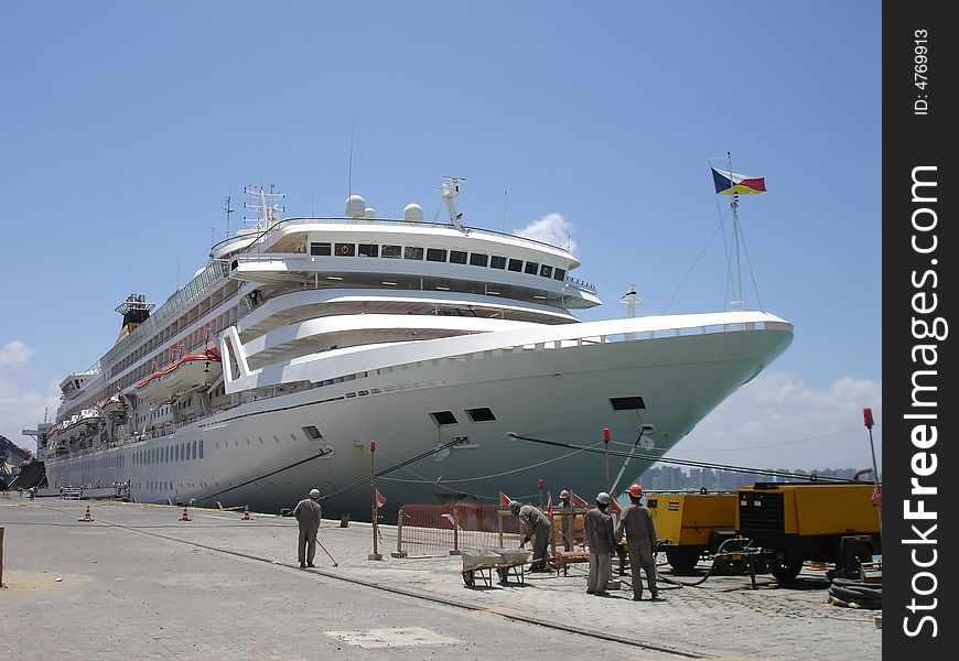 A white cruise ship at dock.