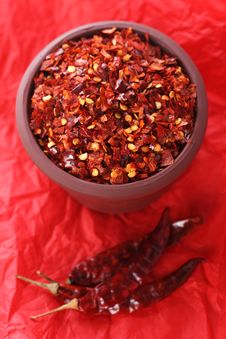 Hot Red Chilli Chillies Crushed Pepper On Red Stock Image