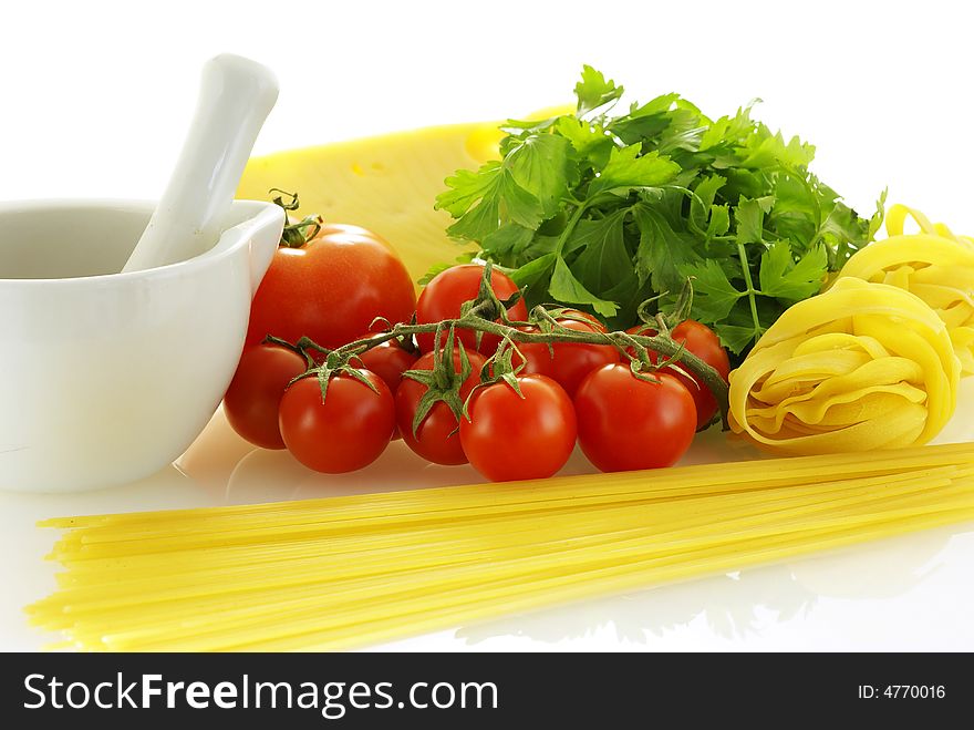 Fresh raw ingredients for making pasta over white background