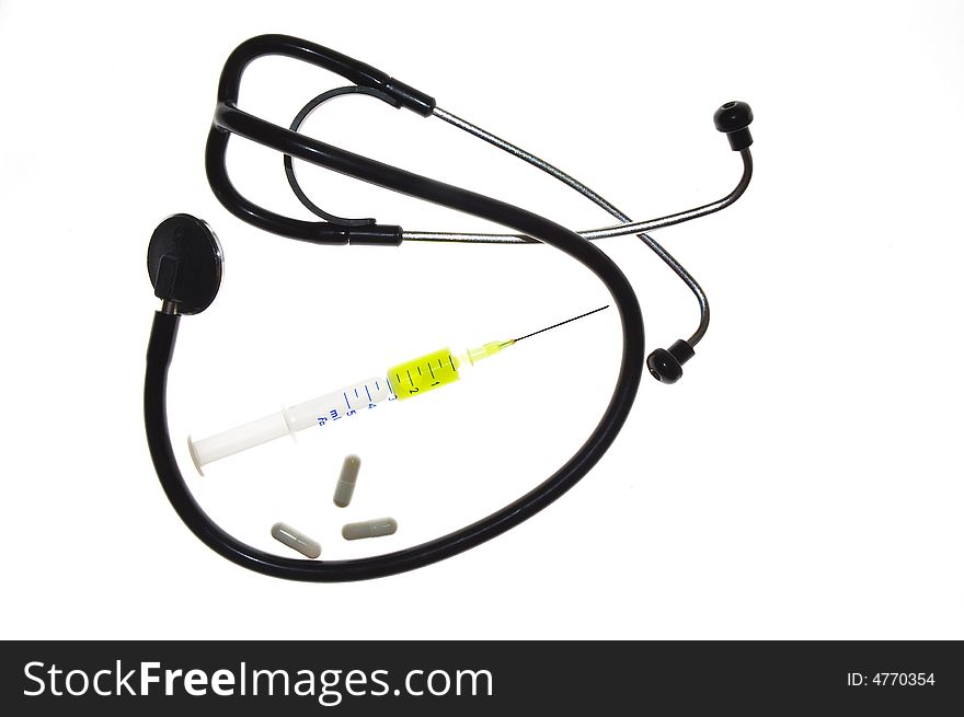 Stethoscope, syringe and pills isolated over white background
