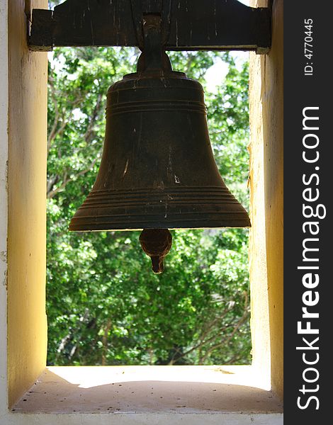 A bronze, metallic church bell.