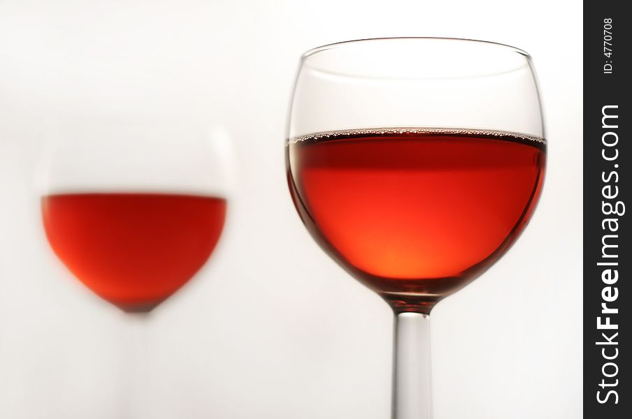 Two glasses of a red wine, close up with selective focus