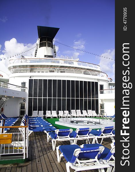 Cruise ship sun deck with chairs.