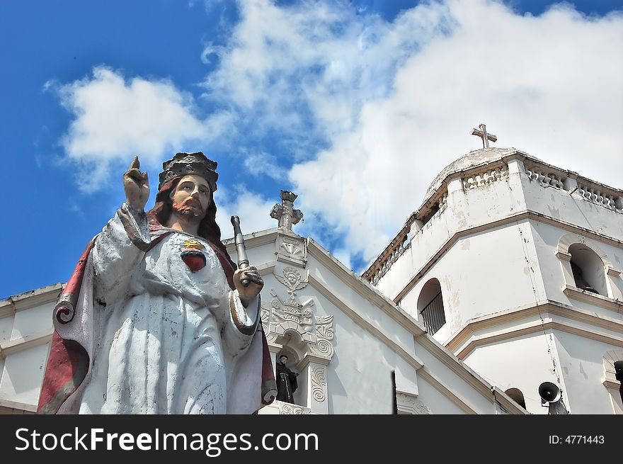 Jesus statue in front of a church