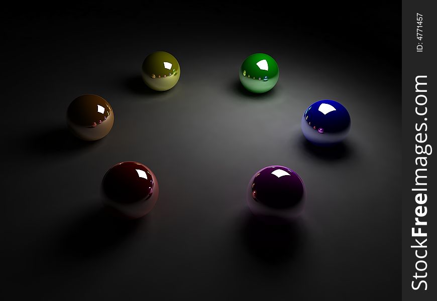 Colored balls on black background with relections