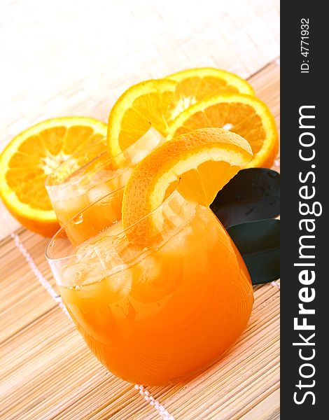 Orange and orange juice in a glass