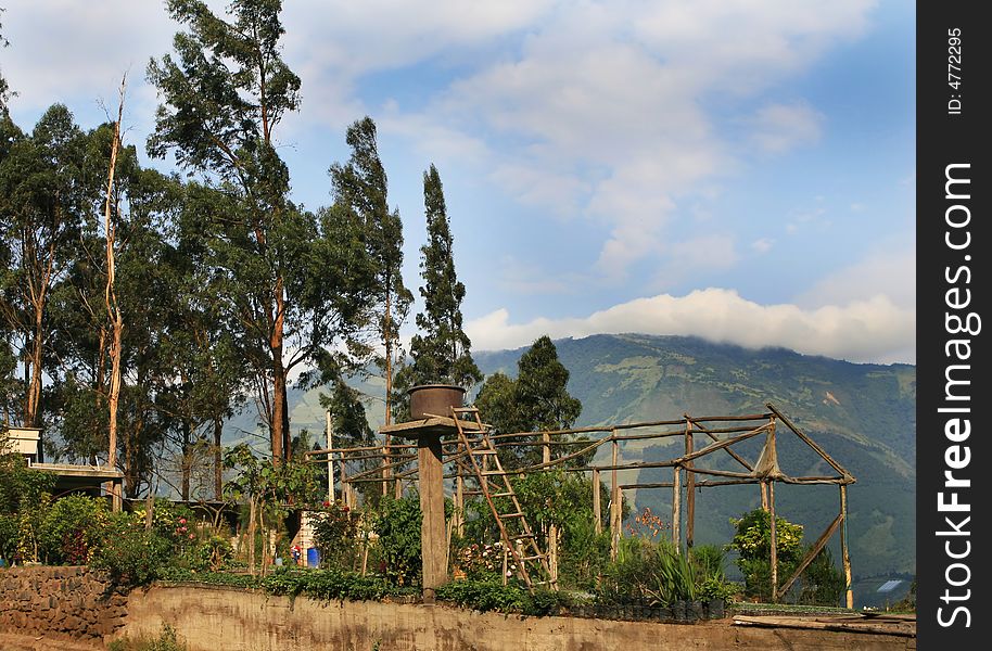 A rural greenhouse and water tower in the Andes Mountains of Eduador