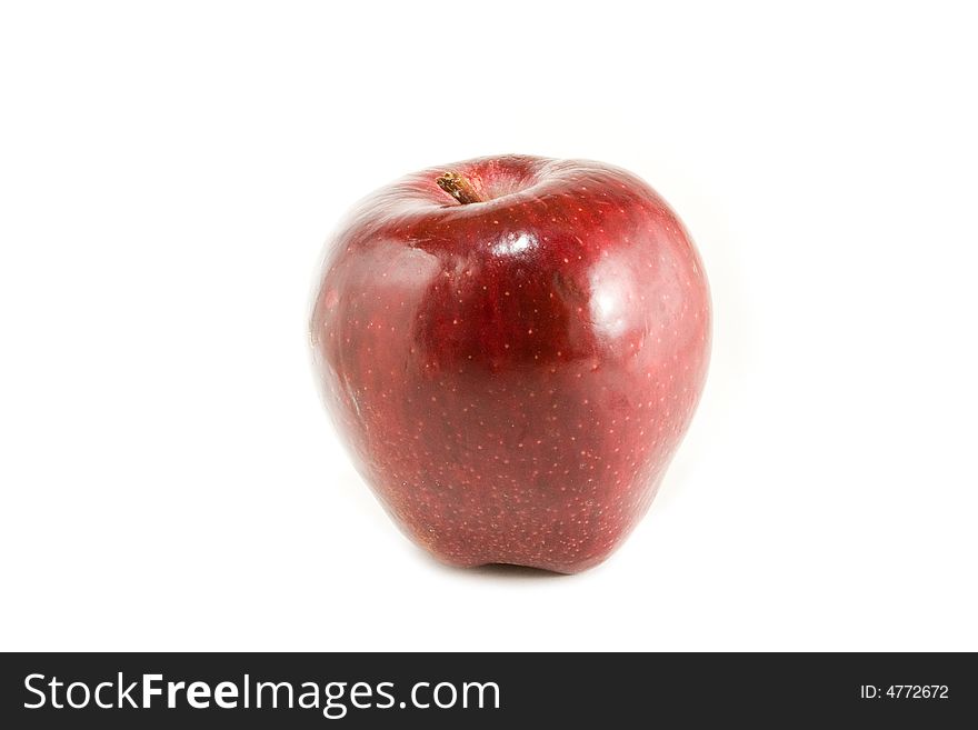 An isolated red apple over white background.