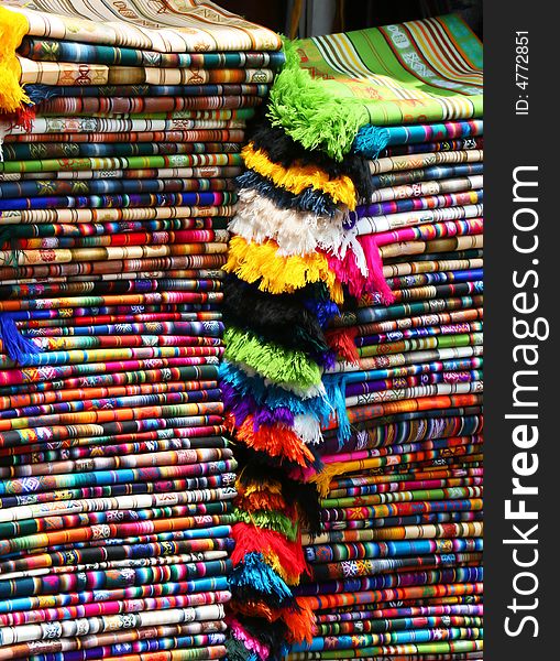 Color fabric patterns stacked at a marketplace. Color fabric patterns stacked at a marketplace