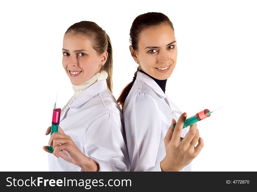 Two young women of the nurse with syringes. Two young women of the nurse with syringes