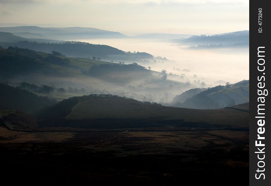 Mist in the valley with hills