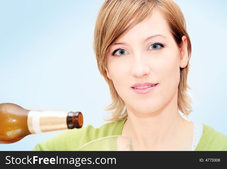 Smiling woman drinking a big glass beer. Smiling woman drinking a big glass beer