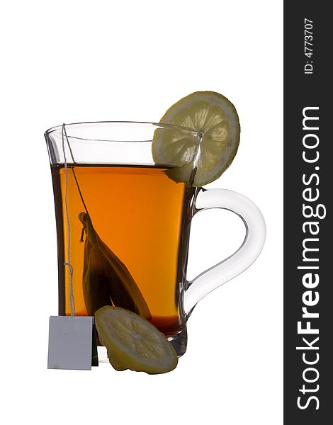 Tea bag in clear glass cup. Tea bag in clear glass cup