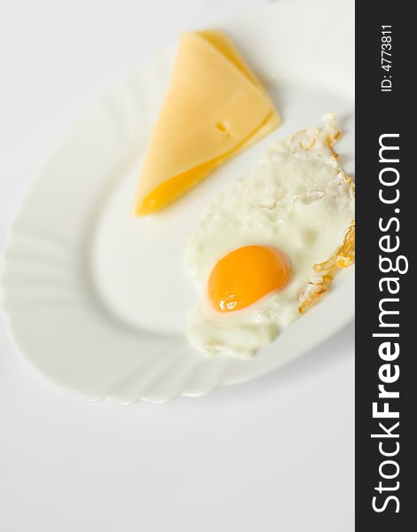 Scrambled eggs and cheese on a plate. Scrambled eggs and cheese on a plate