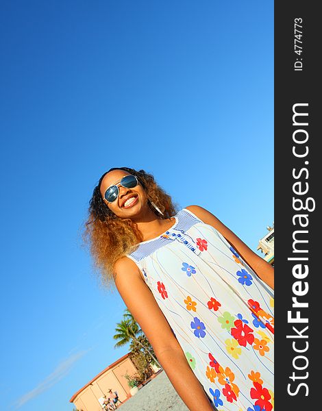 Woman on beach. Shot at low angle. Woman on beach. Shot at low angle.