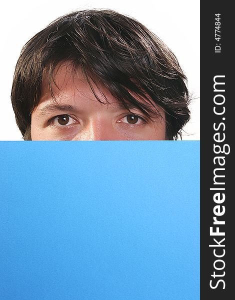 Portrait of young man, holding a blue billboard. Portrait of young man, holding a blue billboard