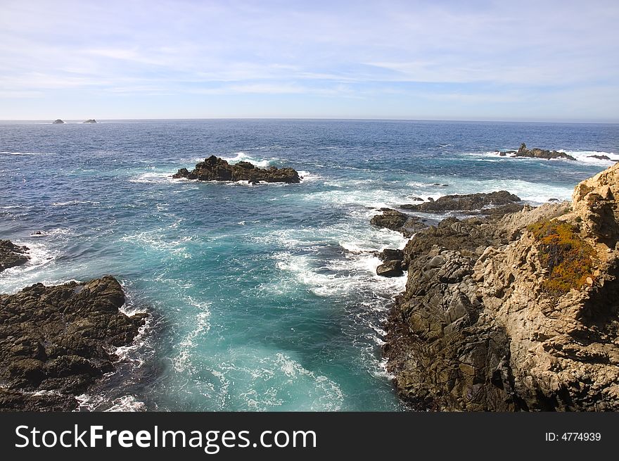 View of the cliffs and the Pacific Ocean from the the headlands south of Monterey in California. View of the cliffs and the Pacific Ocean from the the headlands south of Monterey in California