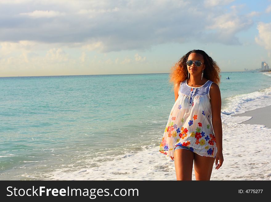 Woman Walking By The Shore