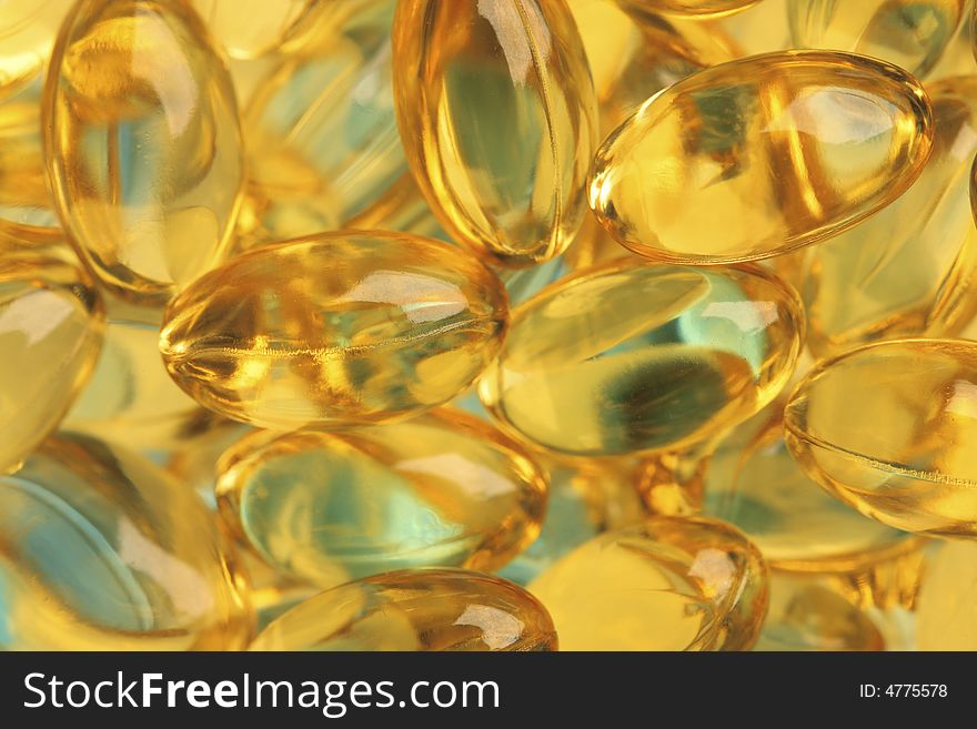 Healthy fish oil nutritional supplements pills / close-up macro. Healthy fish oil nutritional supplements pills / close-up macro