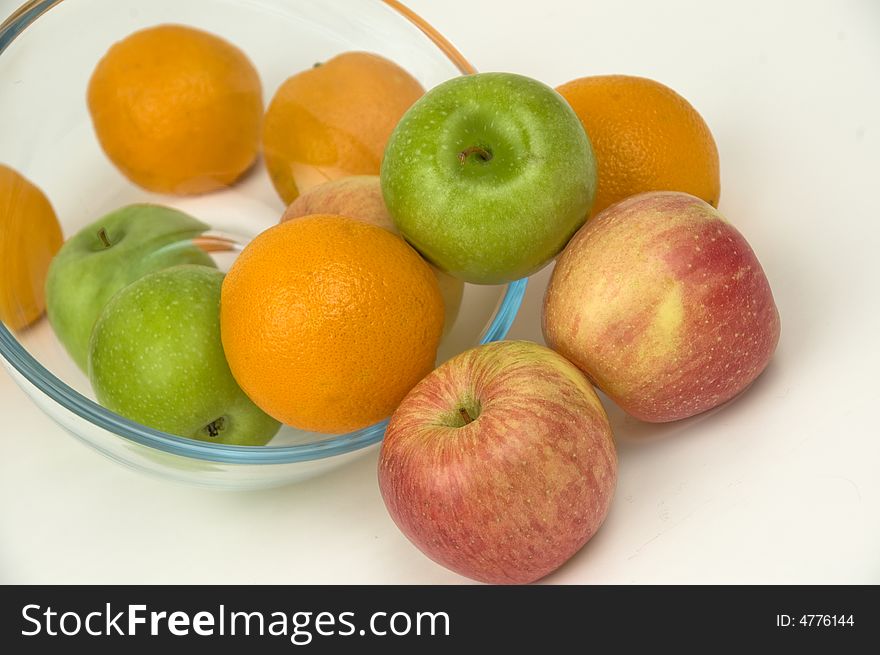 Fresh fruit in glasswares on a white background. Fresh fruit in glasswares on a white background.