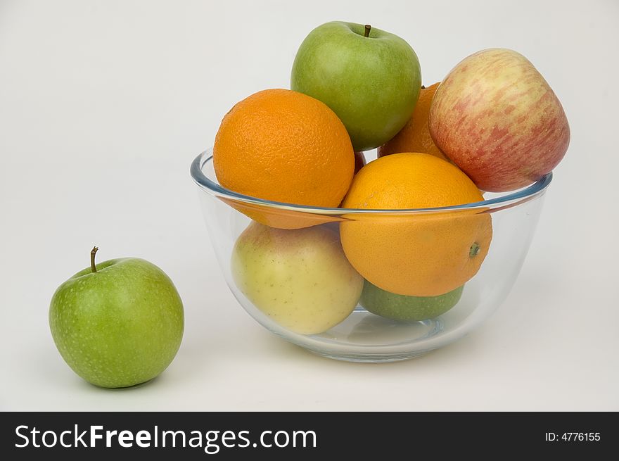 Fresh fruit in glasswares on a white background. Fresh fruit in glasswares on a white background.