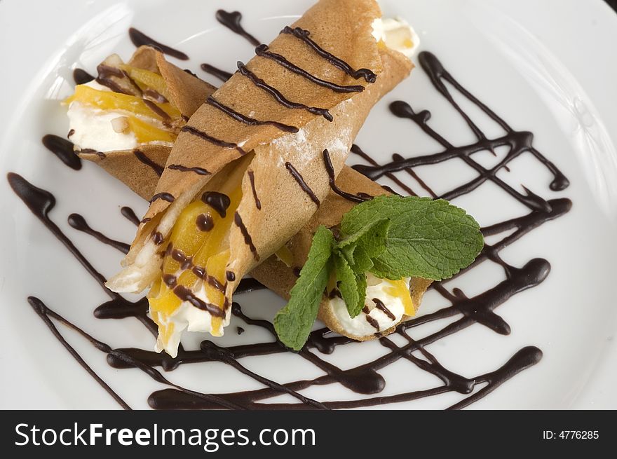 Pancakes with fruit, whipped cream in chocolate. Pancakes with fruit, whipped cream in chocolate.