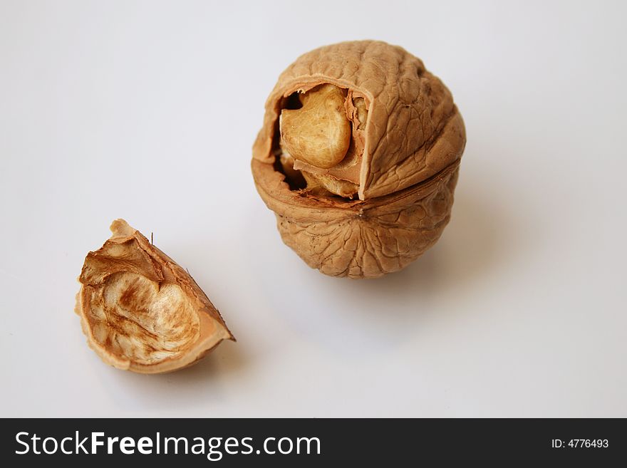 Broken walnut on white, isolated. Broken walnut on white, isolated