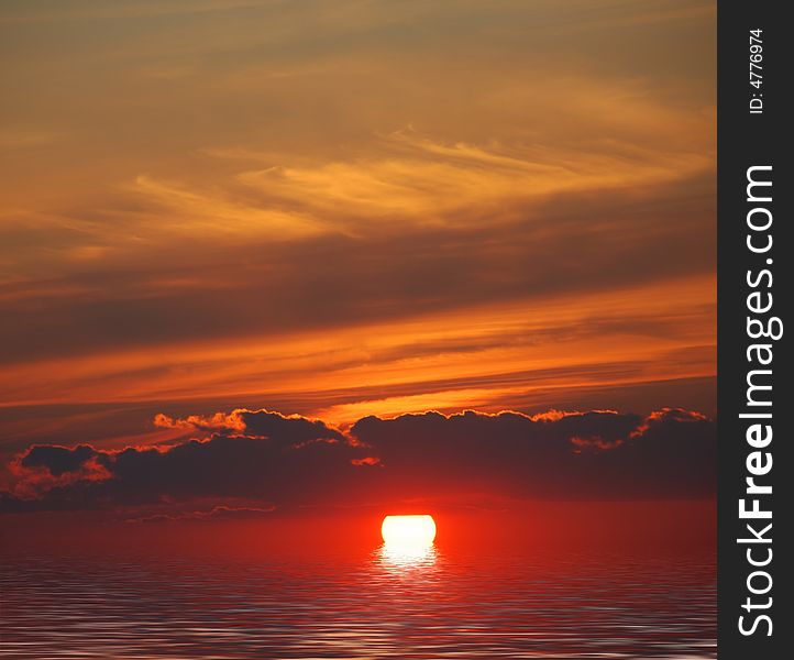 Sunrise in ocean.red sun in clouds