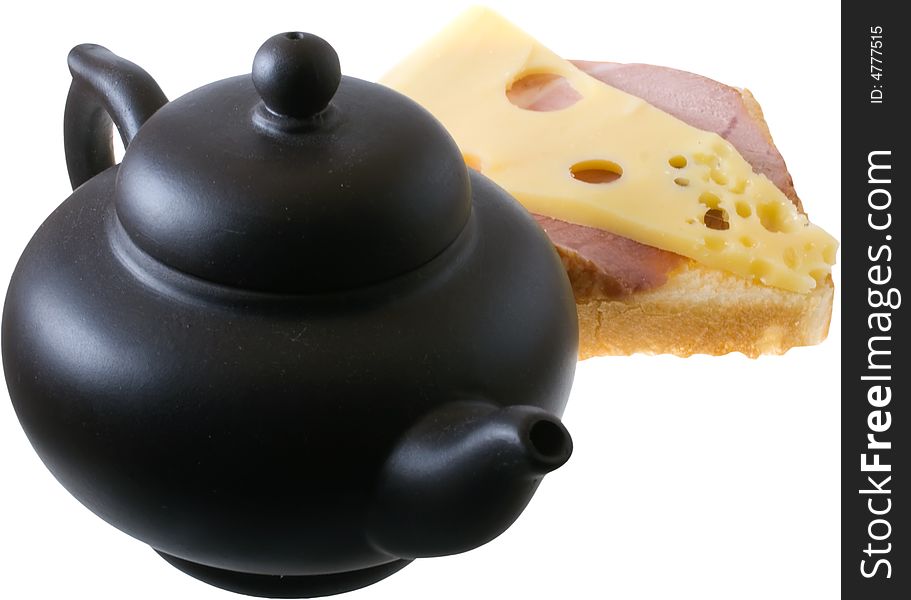 Isolated tasty sandwiche and black teapot. Isolated tasty sandwiche and black teapot