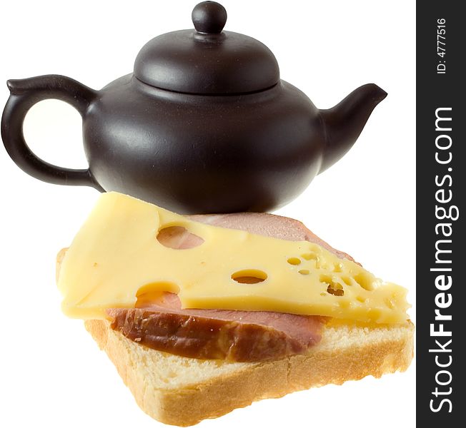 Isolated tasty sandwiche (cheese and meat) and teapot. Isolated tasty sandwiche (cheese and meat) and teapot
