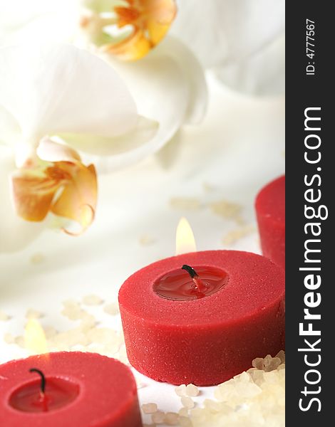 Aromatherapy candles and white orchid