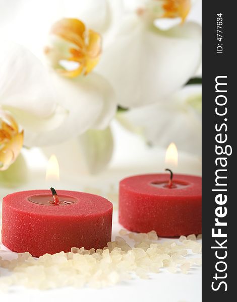 Aromatherapy candles and white orchid