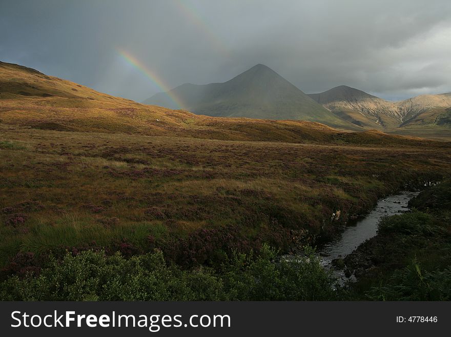 Evening rainbow in scottish highlands. Evening rainbow in scottish highlands.