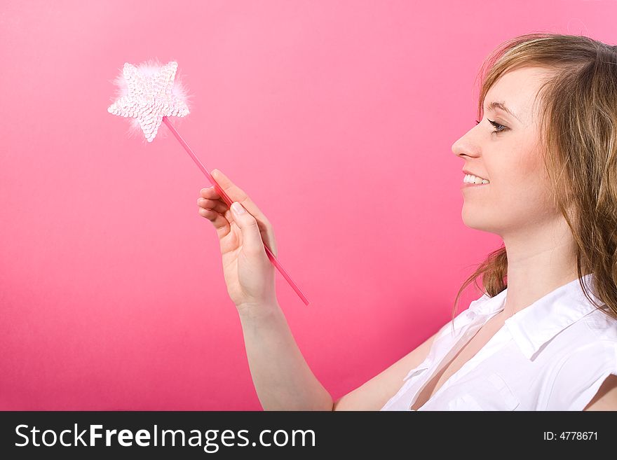 Happy fairy with wand in the hand on the pink background. Happy fairy with wand in the hand on the pink background