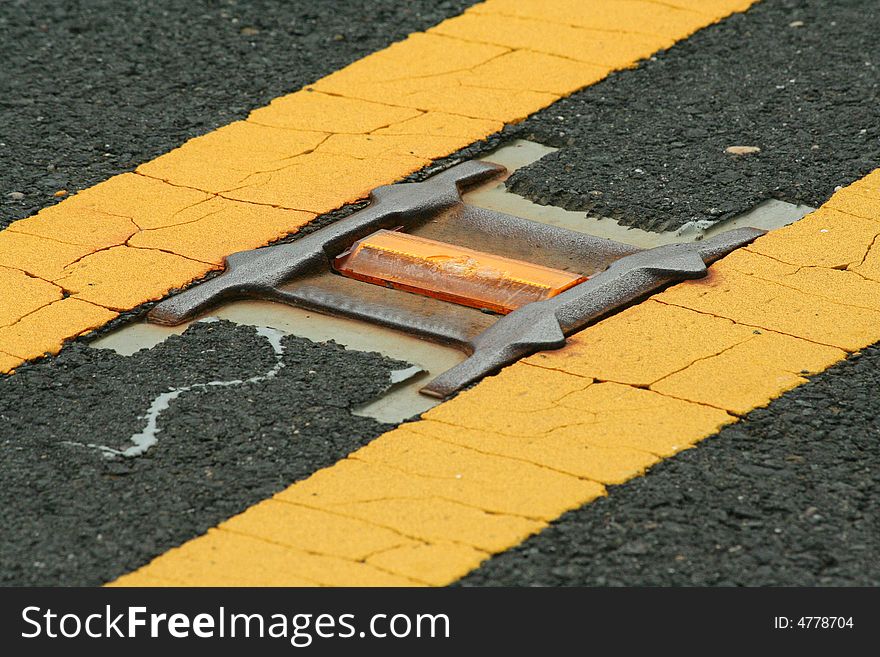 A Road reflector lane marker in the street