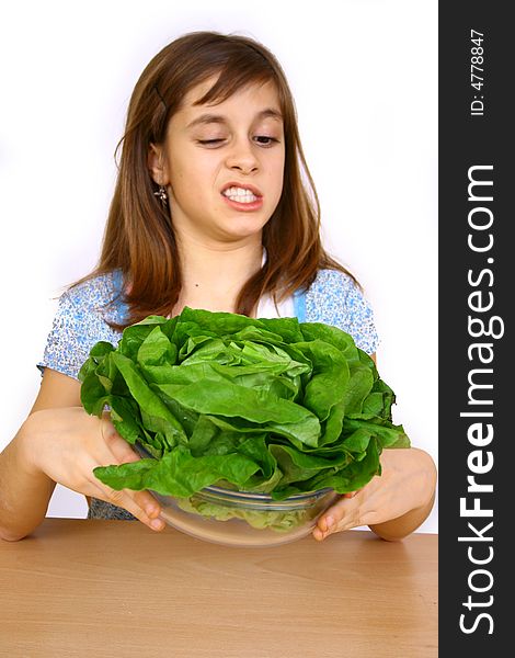 Girl eating a salad a over white background