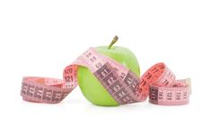 Green Apple And Tape Measure Royalty Free Stock Image