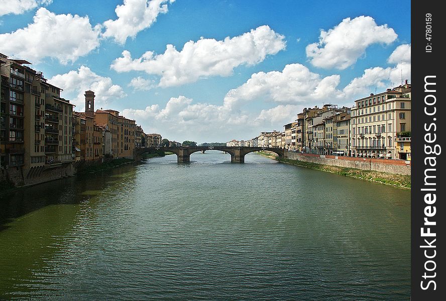 View on Arno river and bridge on it from another bridge. Florence, Italy. View on Arno river and bridge on it from another bridge. Florence, Italy