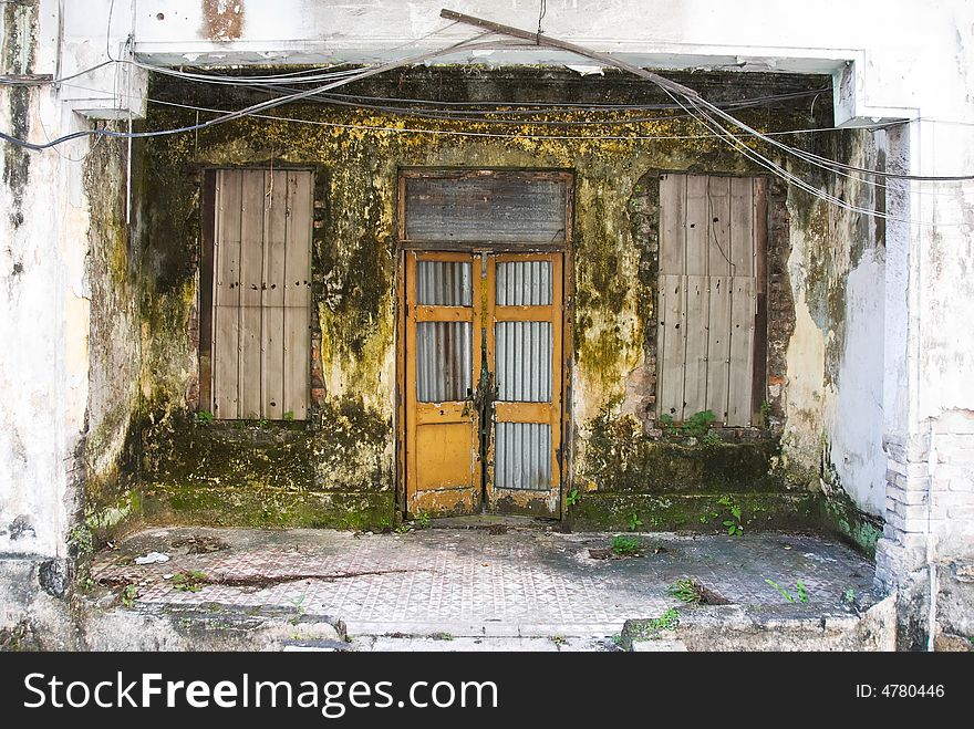 Dirty decayed house front in kuala lumpur