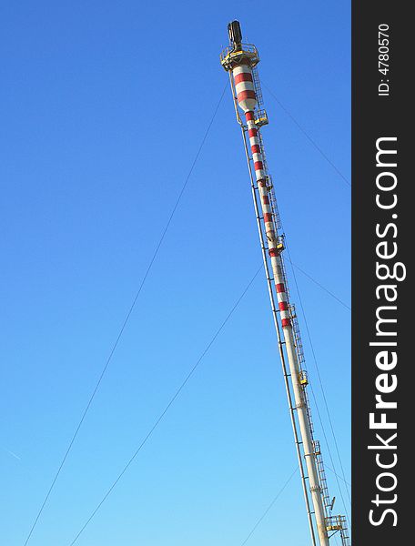 New factory chimney. Red and white.